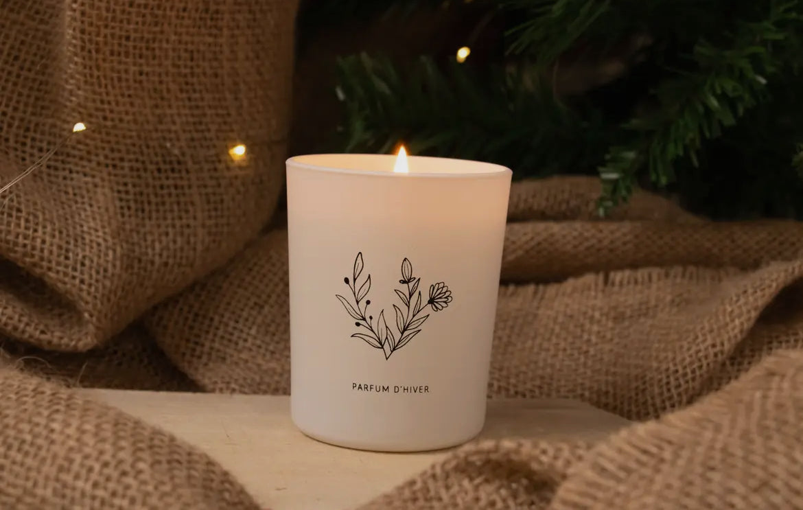 Candle with a decorative label on a rustic background
