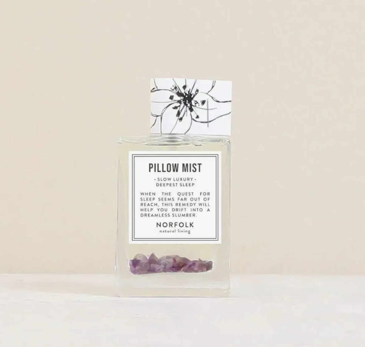 Pillow Mist - Deepest Sleep bottle with label on a beige background