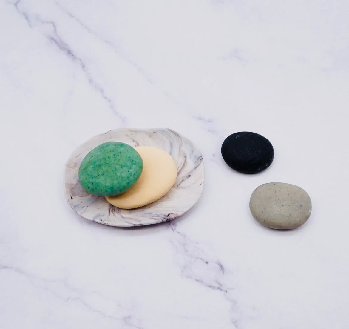 Porcelain Dish Set with 4 Handmade Soaps on a marble background