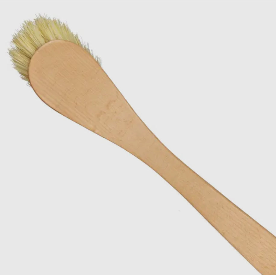 Wooden brush with bristle head on a white background