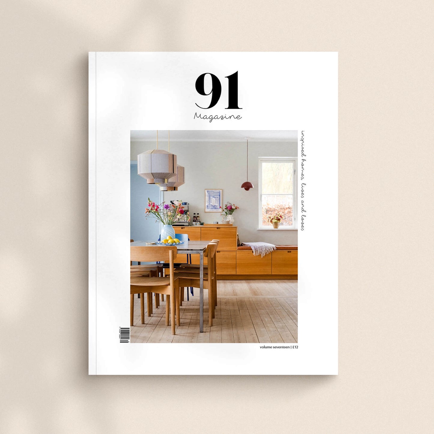 Magazine cover with a dining room scene on a beige background