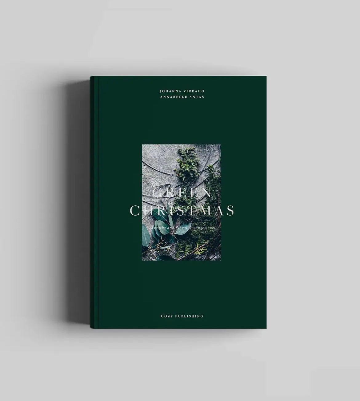 Book titled 'Green Christmas' with a green cover on a light gray background