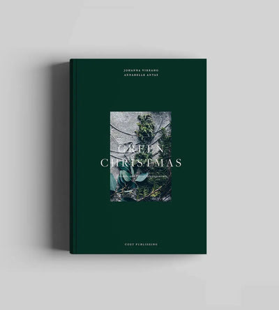Book titled 'Green Christmas' with a green cover on a light gray background