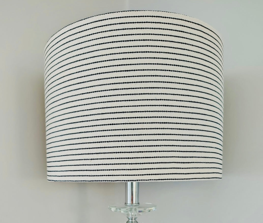Striped lampshade on a plain background