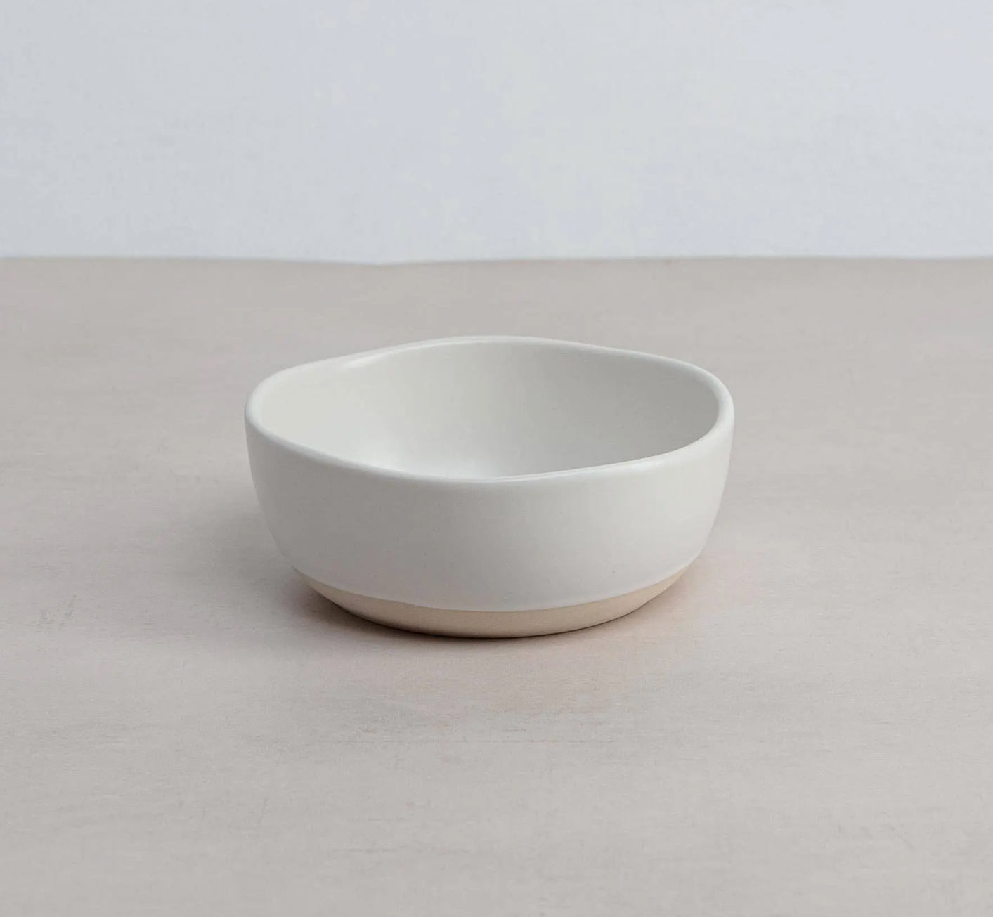 White ceramic Organics Cereal Bowl on a light gray surface with a white background
