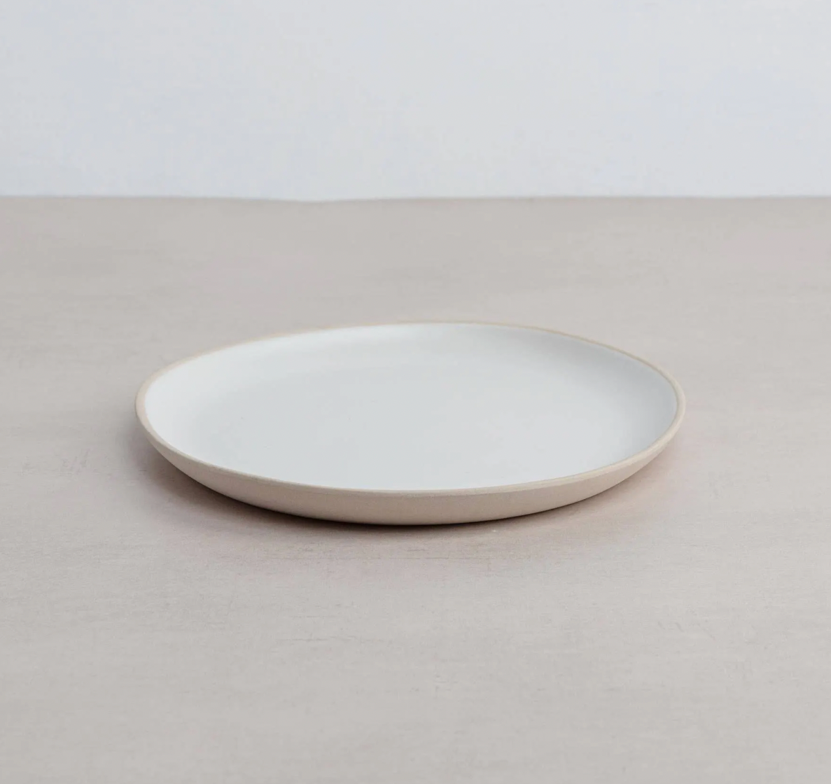 White ceramic Organics Side Plate on a light gray background