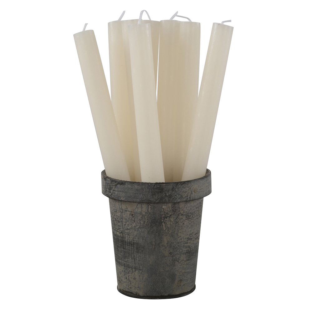 Set of white candles in a rustic metal holder on a white background
