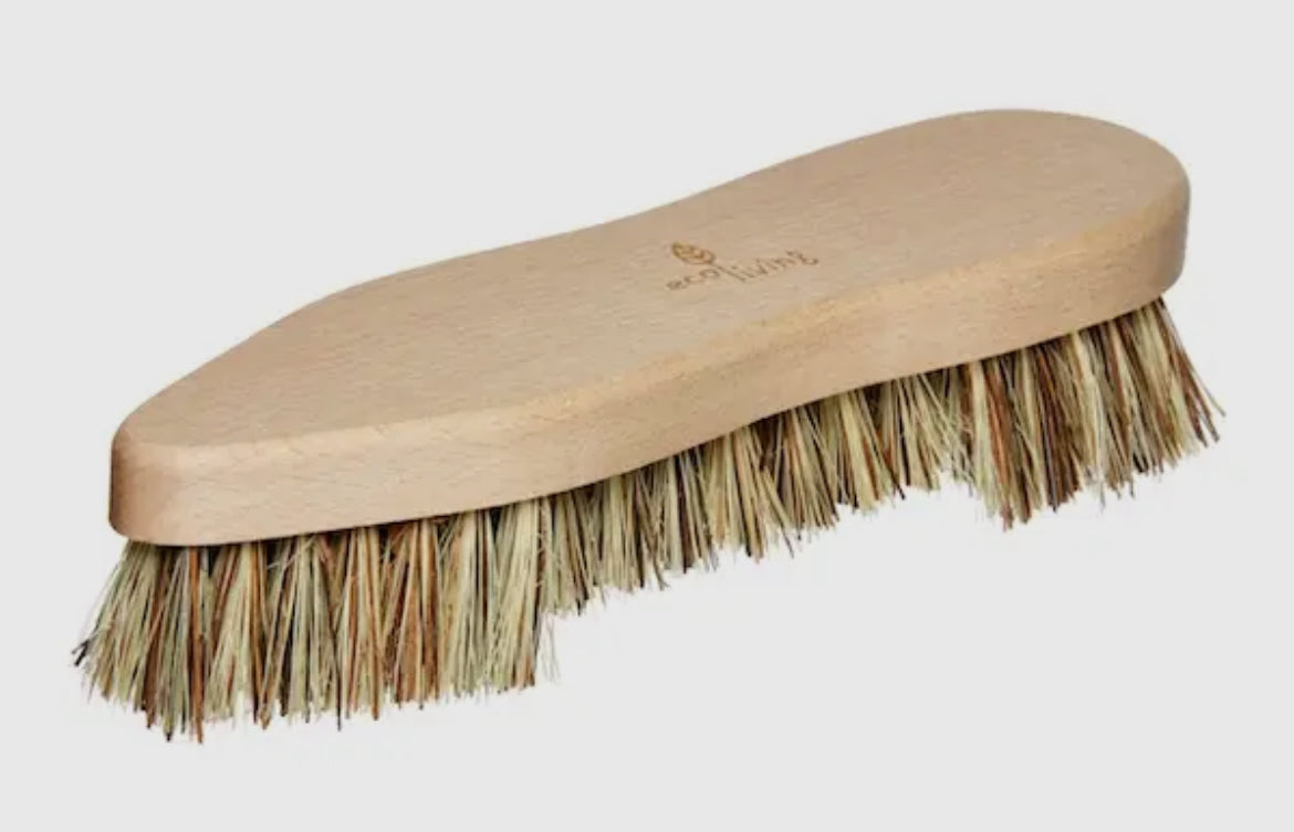 Beige brush with bristles on a light gray background
