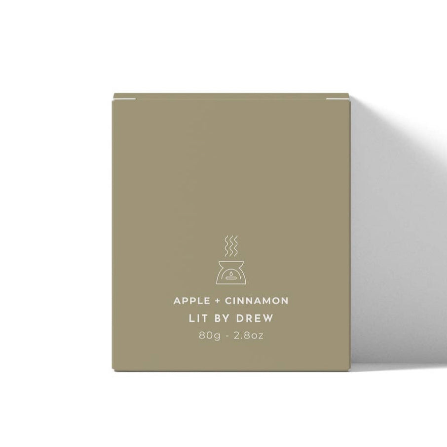Beige box with 'Lit by Drew' branding and product details on a white background