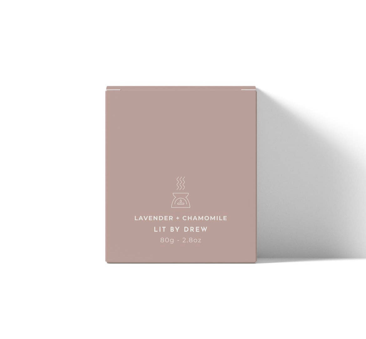 Pink packaging box with 'Lit by Drew' branding on a white background