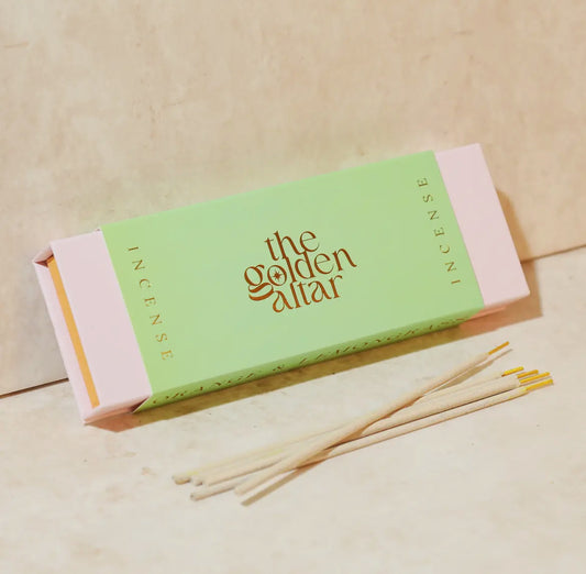 Incense packaging with 'The Golden Altar' branding on a beige background