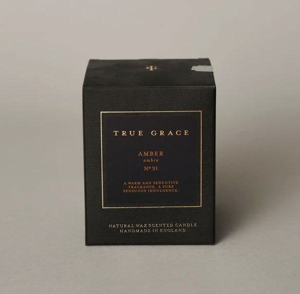 Black candle box with 'True Grace' branding on a gray background